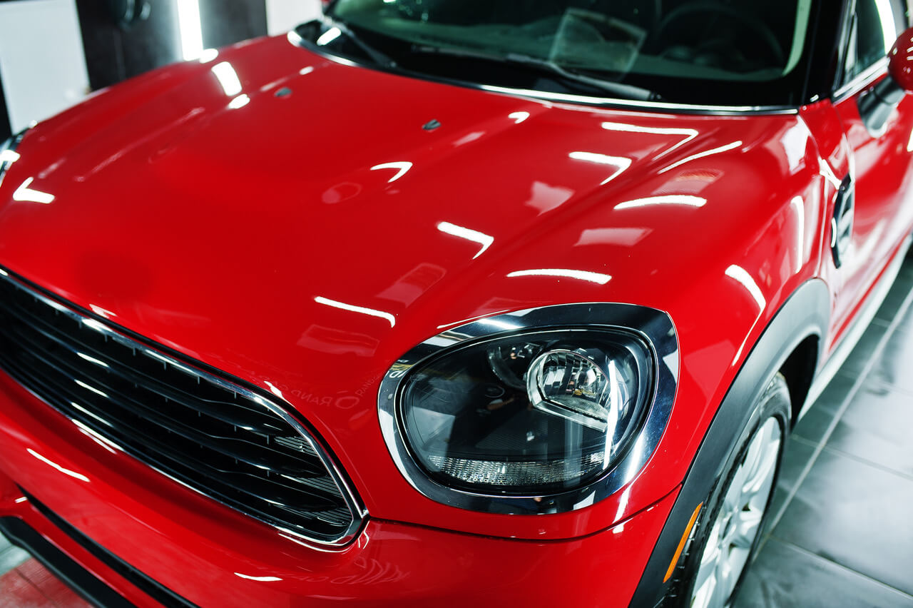 headlights-and-hood-of-sport-red-car